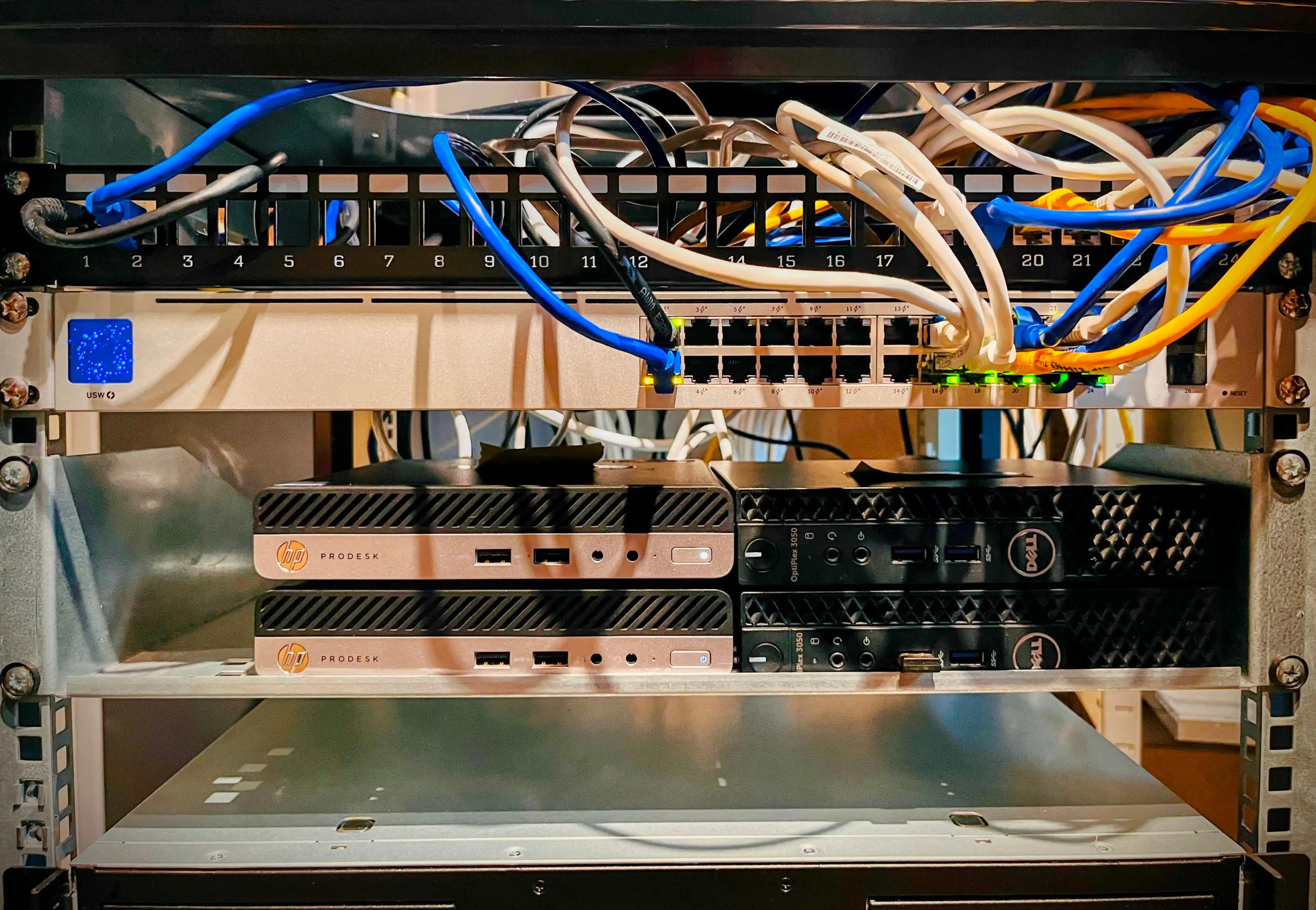 Photo of the first homelab servers that were set up in the server rack with Proxmox installed